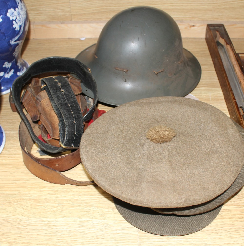 A WWII steel helmet, a Royal Gloucestershire Hussars cap, a Scots Guards? cap, three leather items and a Union Jack